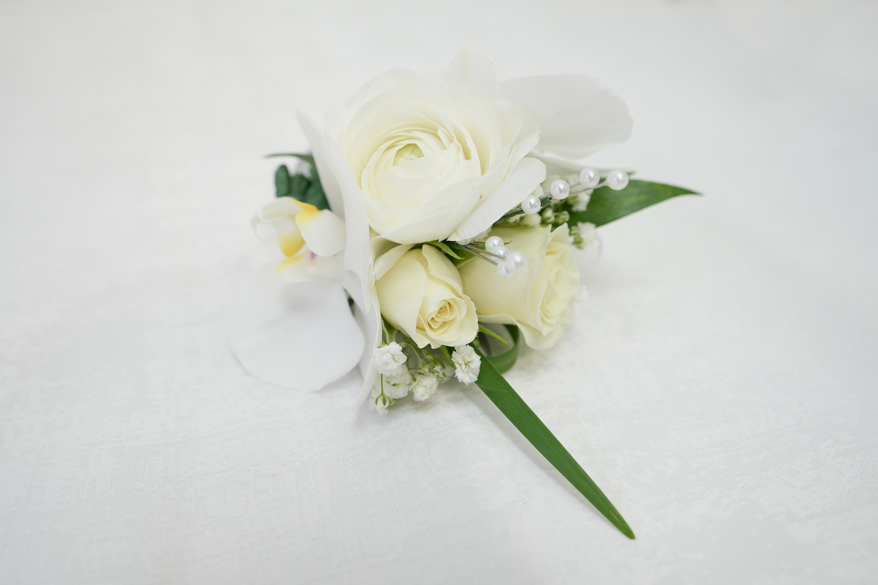White Ranunculus & Rose Corsage