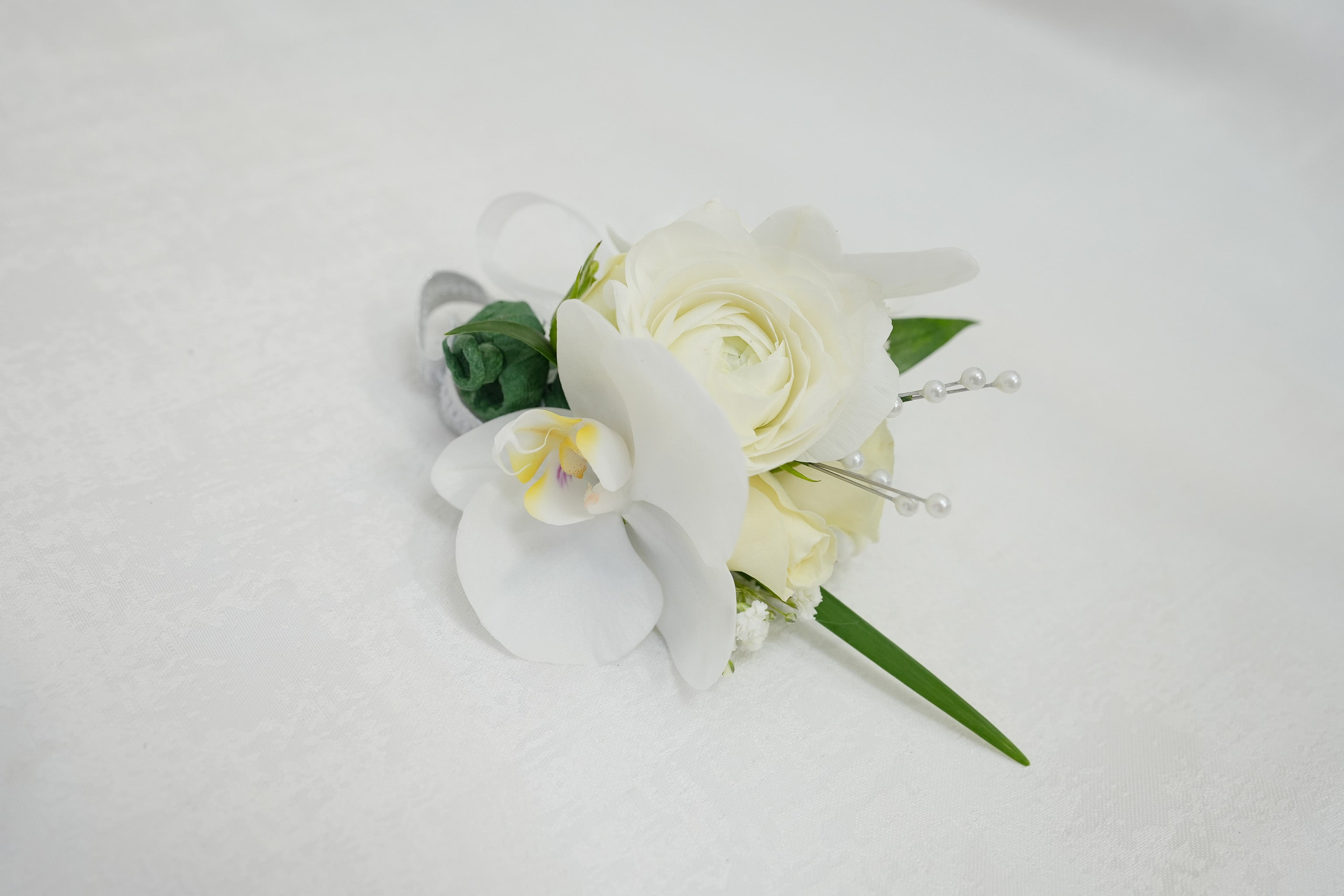 White Ranunculus & Rose Corsage
